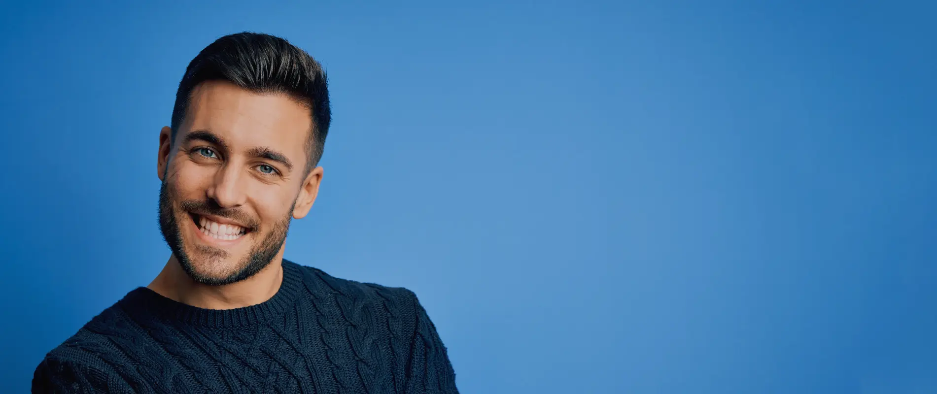 Man Smiling On Blue Background
